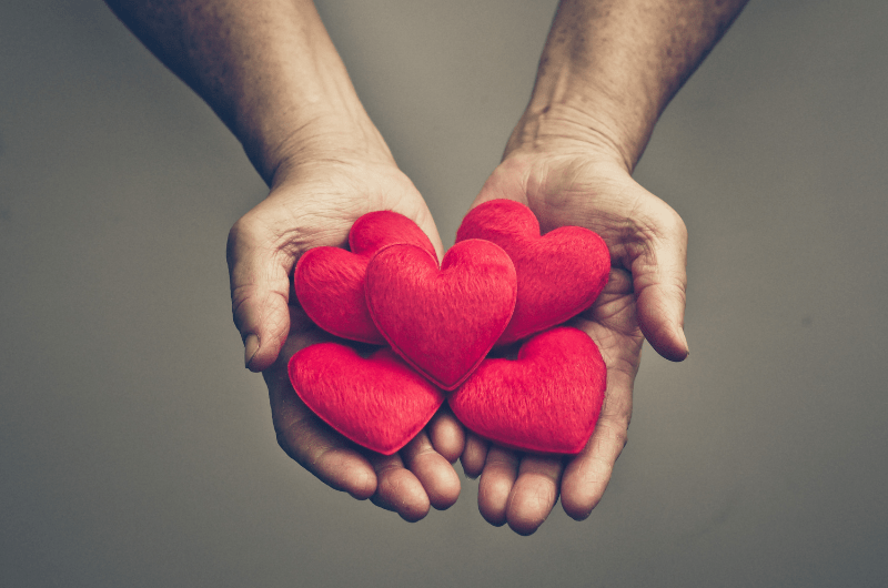 hands holding hearts